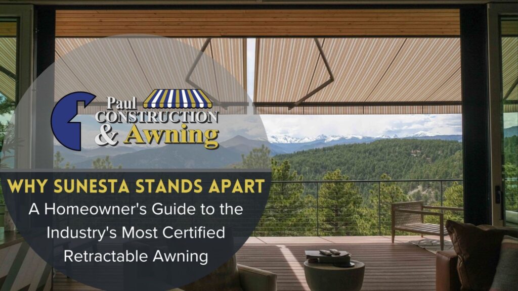 Striped Sunesta retractable awning providing shade for a deck overlooking a forested mountainside.